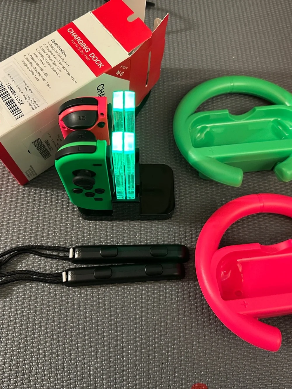 2 Nintendo switch Joy-Con Controllers 2 Racing steering wheels & 1 charging dock